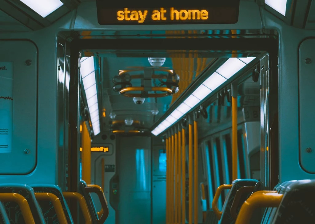 Empty train with social distancing message. Photo: Nicolas Weldingh/Unsplash