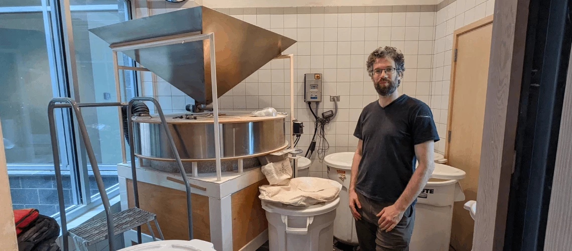 Jonathan and his in-house mill at the bakery. Photo: World Bank