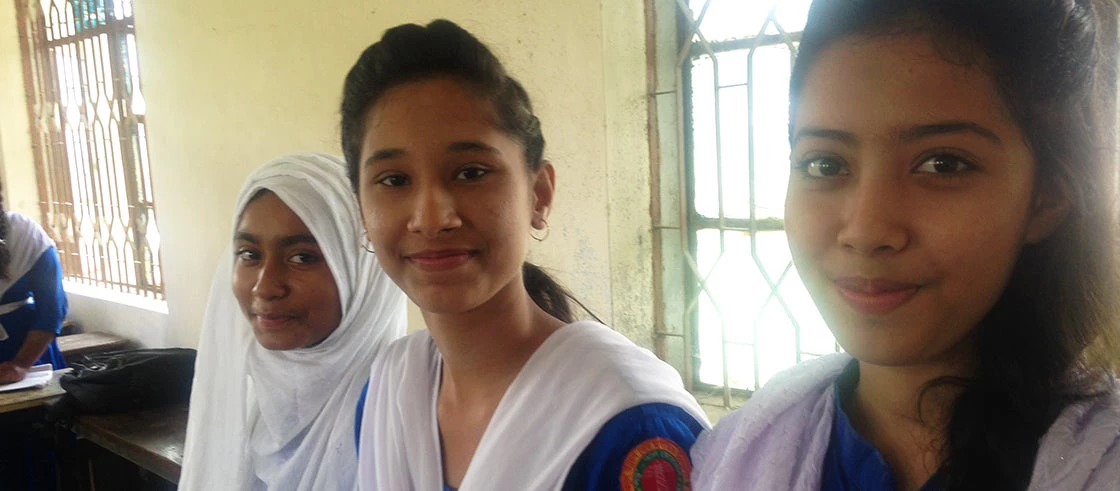 Anika, center, with her friends at the new school. Photo: World Bank