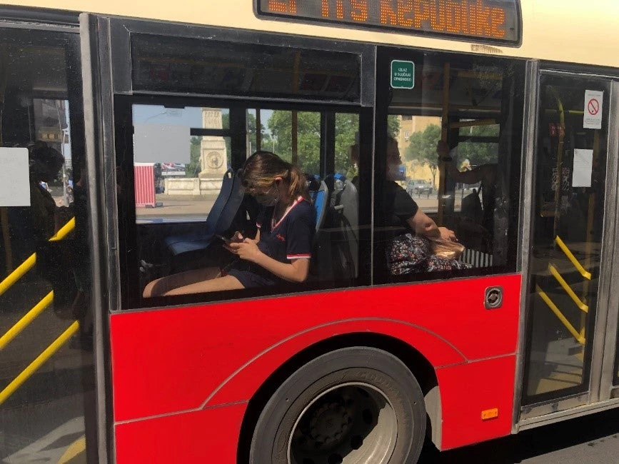 Women ride a public bus in Belgrade