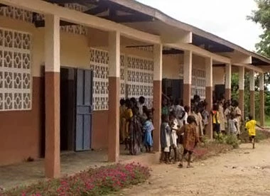 Students gather outside a PNDCC school in Benin. World Bank Photo.