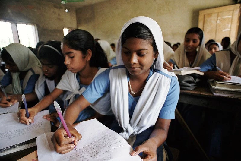 High school girls taking notes. Suapur, Bangladesh.