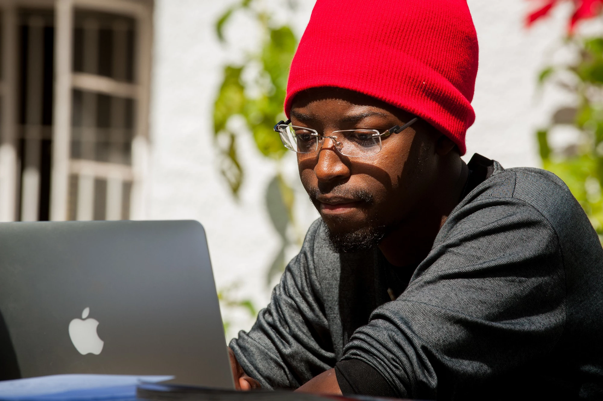 Young man using a computer. Photo: Arne Hoel