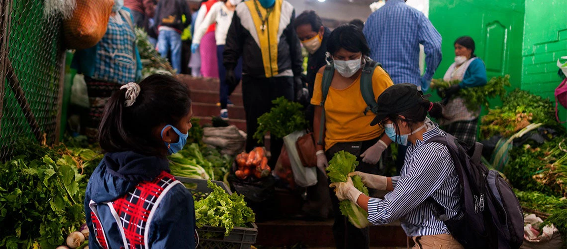 People buying food in San Roque Market, Quito, Ecuador 