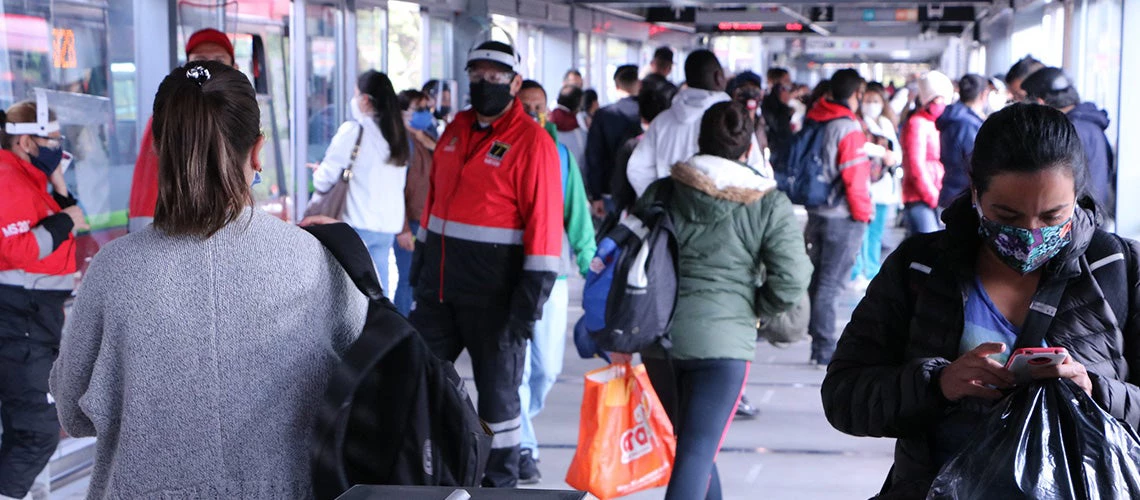 Woman using its smartphone in Bogotá's Transmilenio