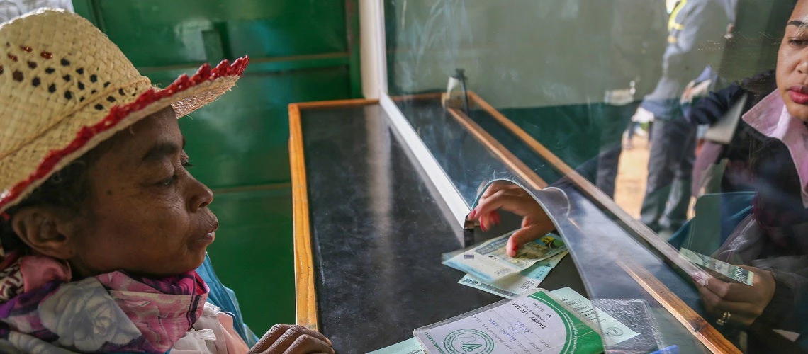 Woman receiving a cash transfer in the town of Betafo, Madagascar