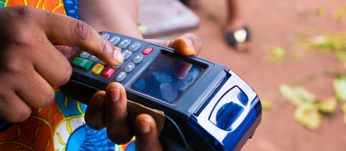 An African woman operates her smart card reader
