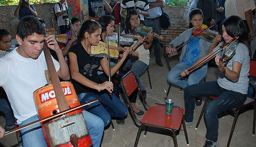 The young musicians in this orchestra from Paraguay built their instruments from recycled materials (photo courtesy of the U.S. Embassy in Paraguay used through a Creative Commons license.)