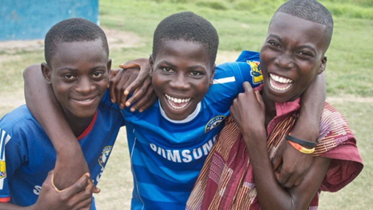 A happy child is a child in school (Ghana).