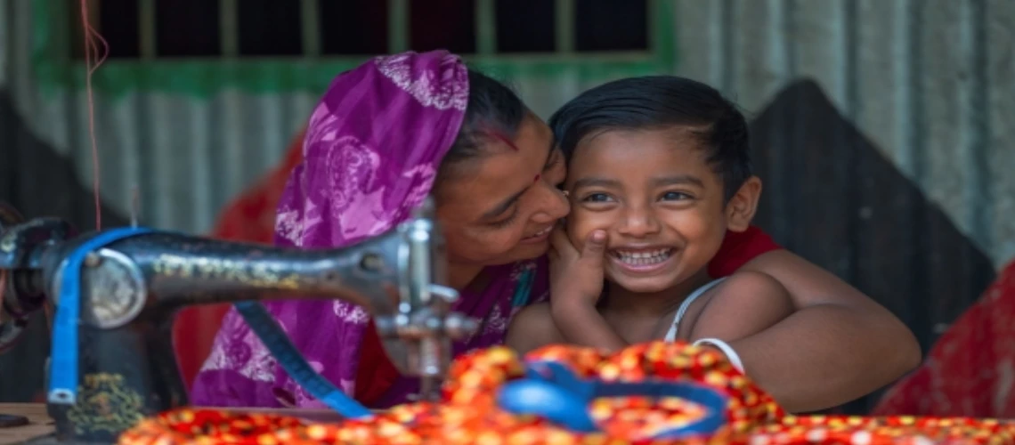 woman and child behind sewing machine