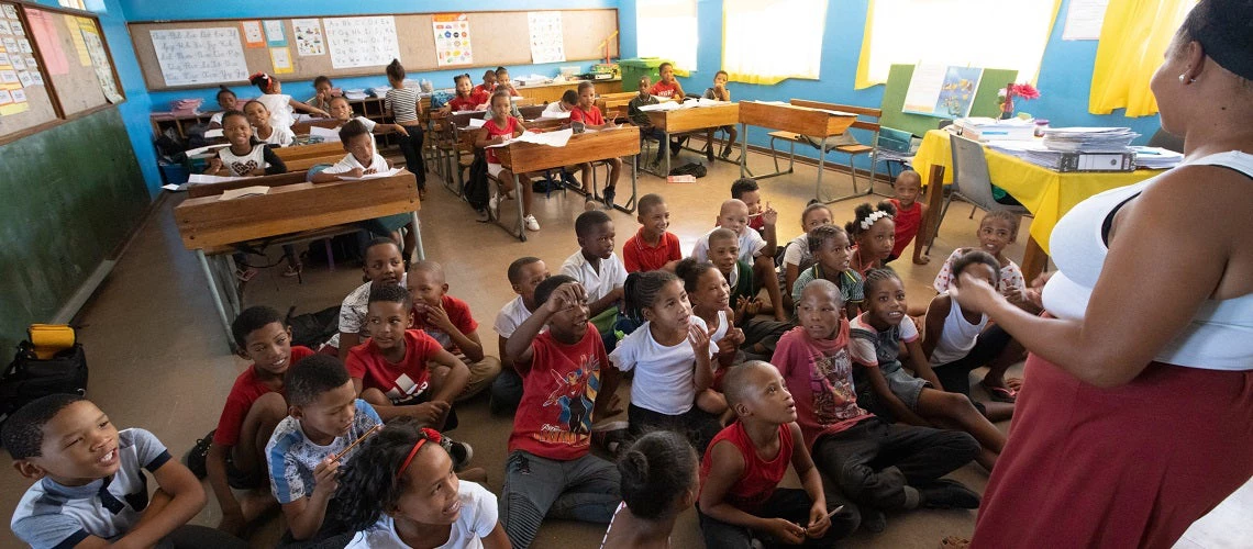 Teacher and school children in a classroom in Boesmanland School in Pofadder, Northern Cape Province, South Africa.