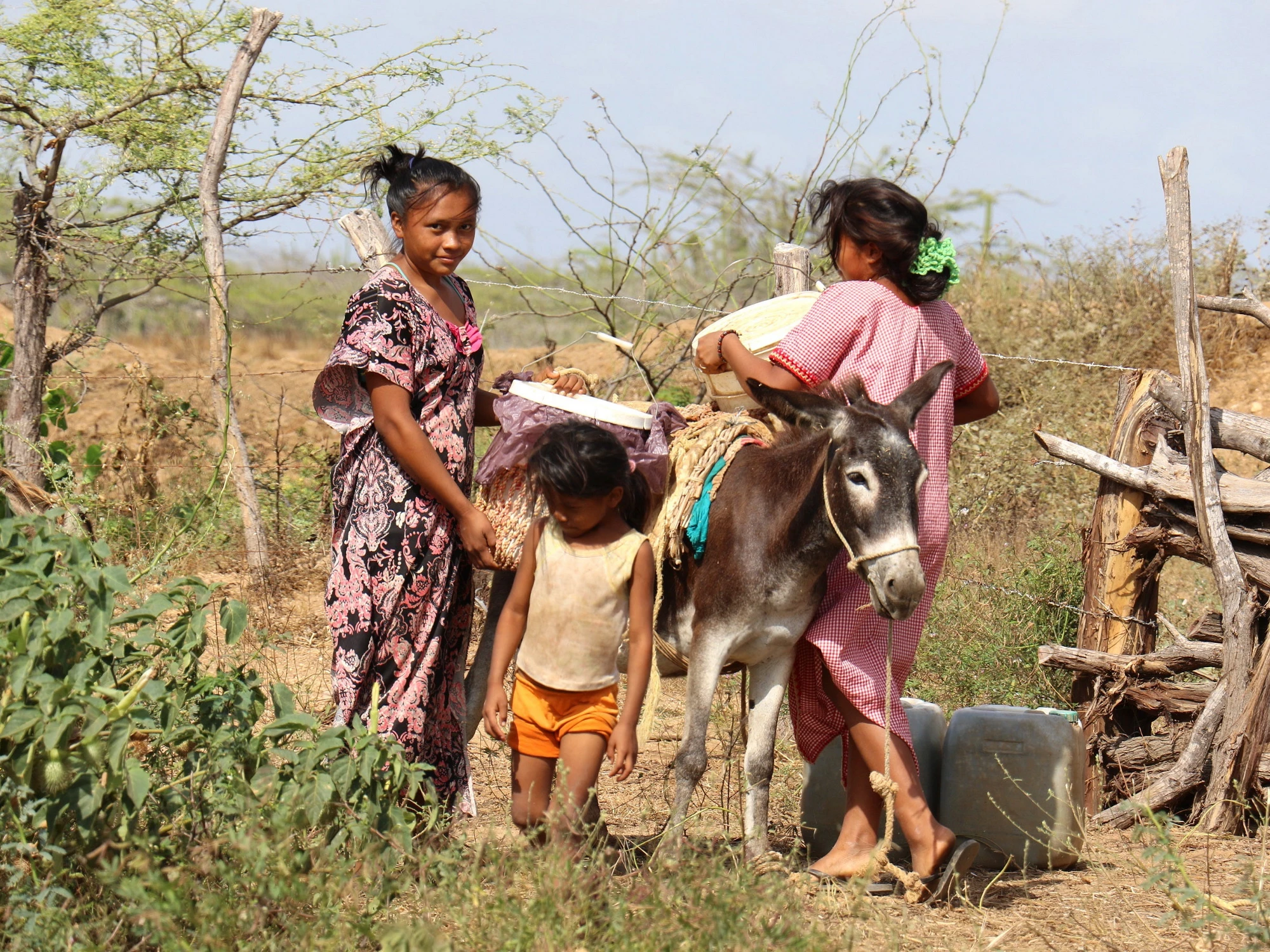 women in Colombia collecting water