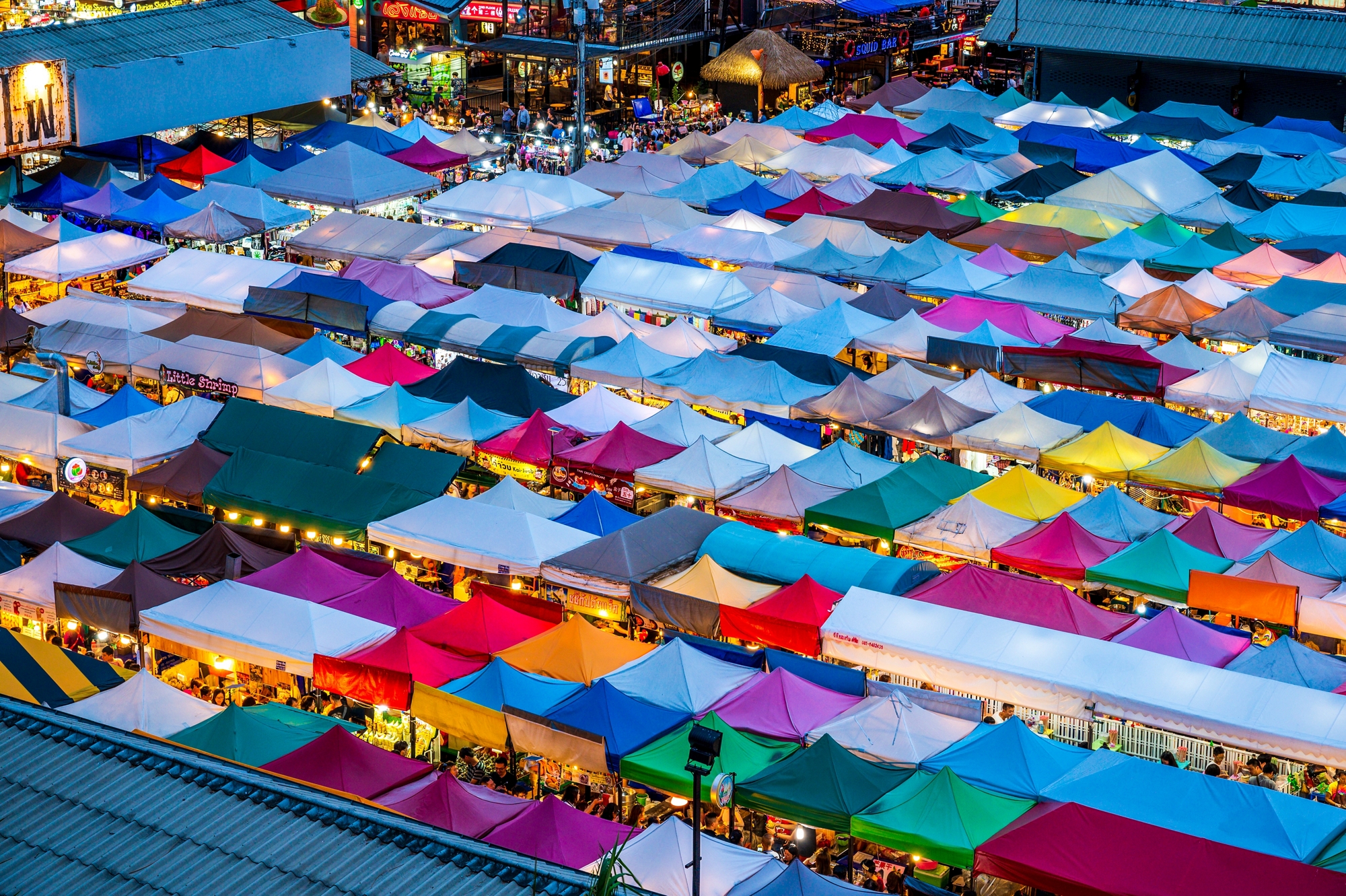 Ratchada Rot Fai Train night market in Bangkok is a famous and thriving night market in Bangkok, Thailand

People and business names visible