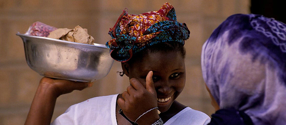 The 2017 Global Findex survey found that 45% of women in Low Income Countries (LICs) do not have an ID compared to 30% of men. Woman selling peanuts in Nigeria. Photo: World Bank 