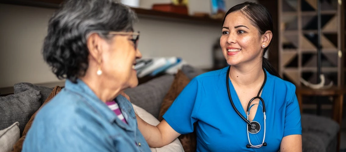 Female doctor checking patient in medical office