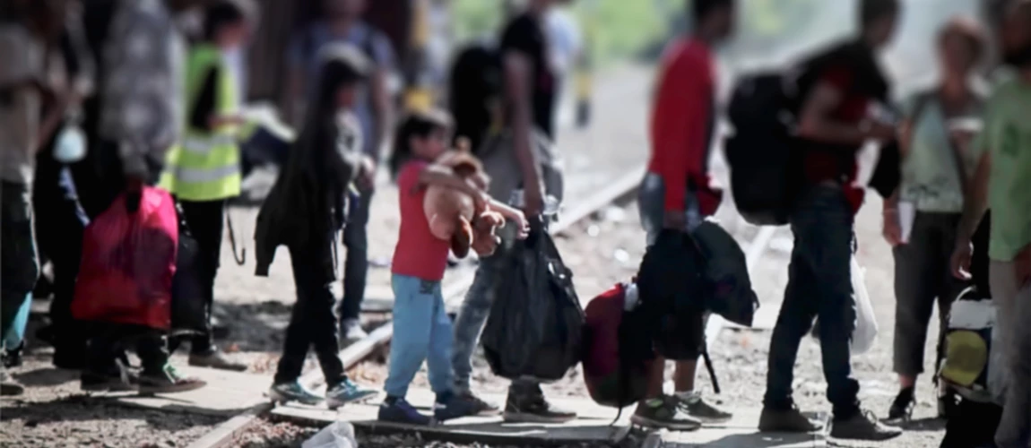 Migrant family at a checkpoint