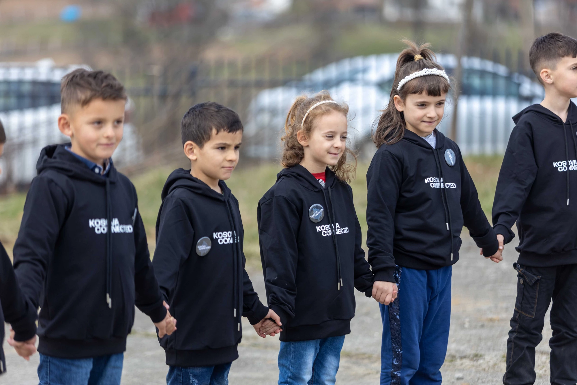 Students taking part in the Kosovo Connected event on March 21, 2023 pose outside of their school in Hertice, Kosovo.
