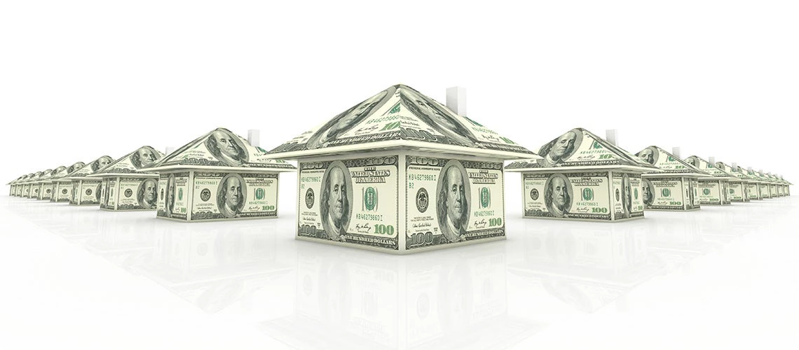 Houses built with 100 dollar bills | © shutterstock.com