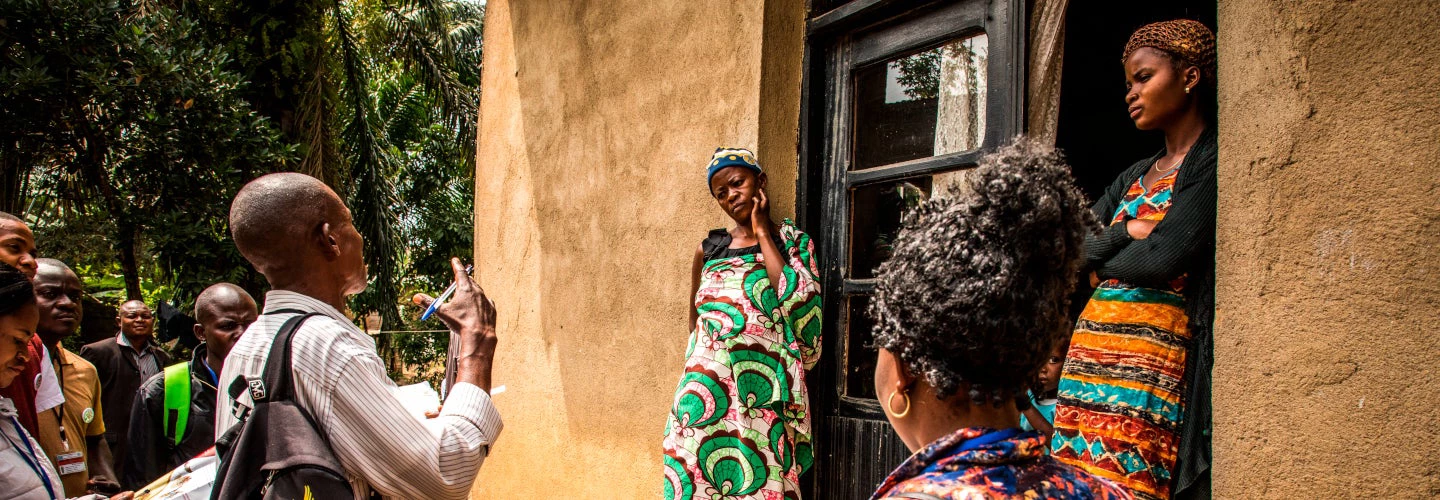 Community representatives visit a family in the outskirts of Beni, DRC, to raise awareness about Ebola. Photo: World Bank / Vincent Tremeau