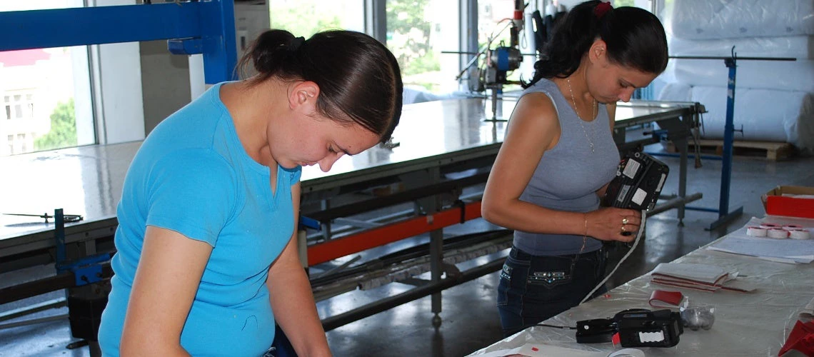 Two women working in a workshop