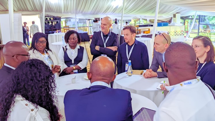 GEI Program Manager Dugan Fraser with representatives from partner countries at the 2024 African Evaluation Association (AfrEA) Conference in Kigali, Rwanda