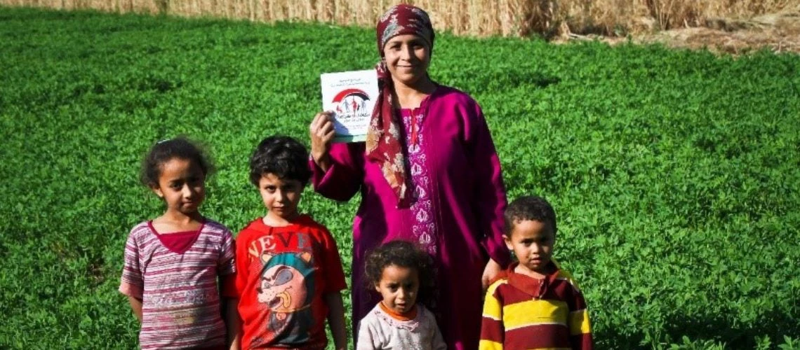 A woman with her 4 children in a field