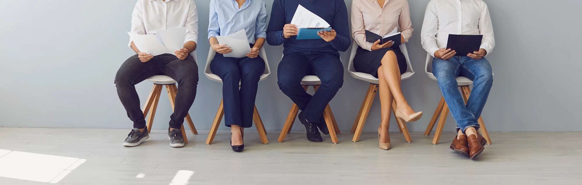 Group of people waiting in line for job interview or office workers waiting for boss's invitation