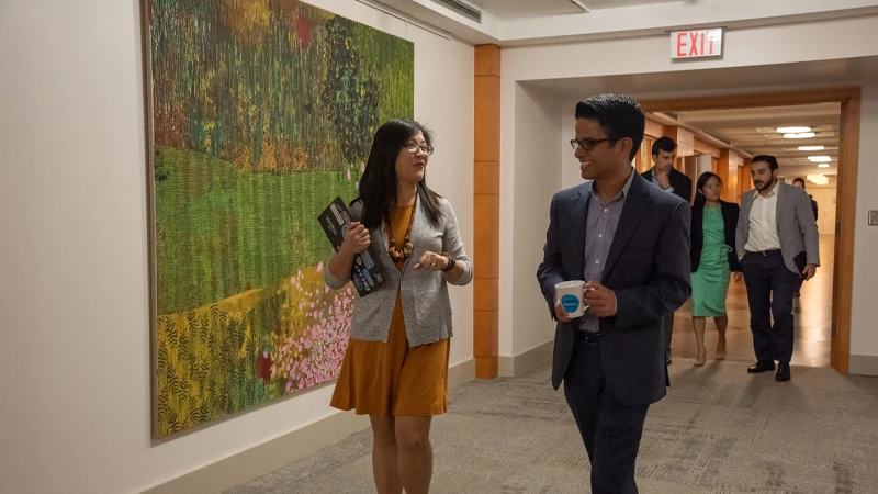 Employees in a hallway at IFC headquarters in Washington D.C (2019)