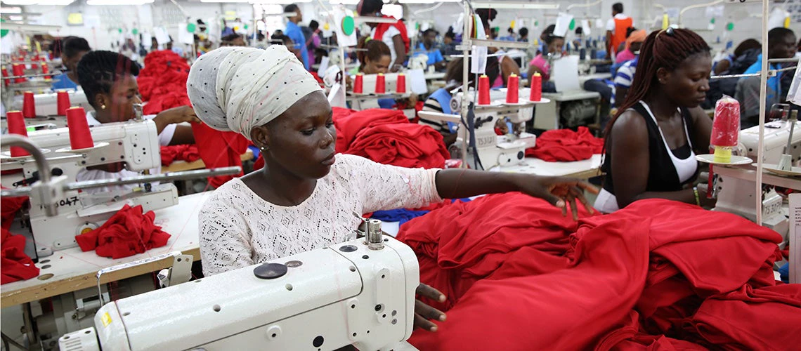 Dignity factory workers producing shirts for overseas clients, in Accra, Ghana | © Dominic Chavez/World Bank