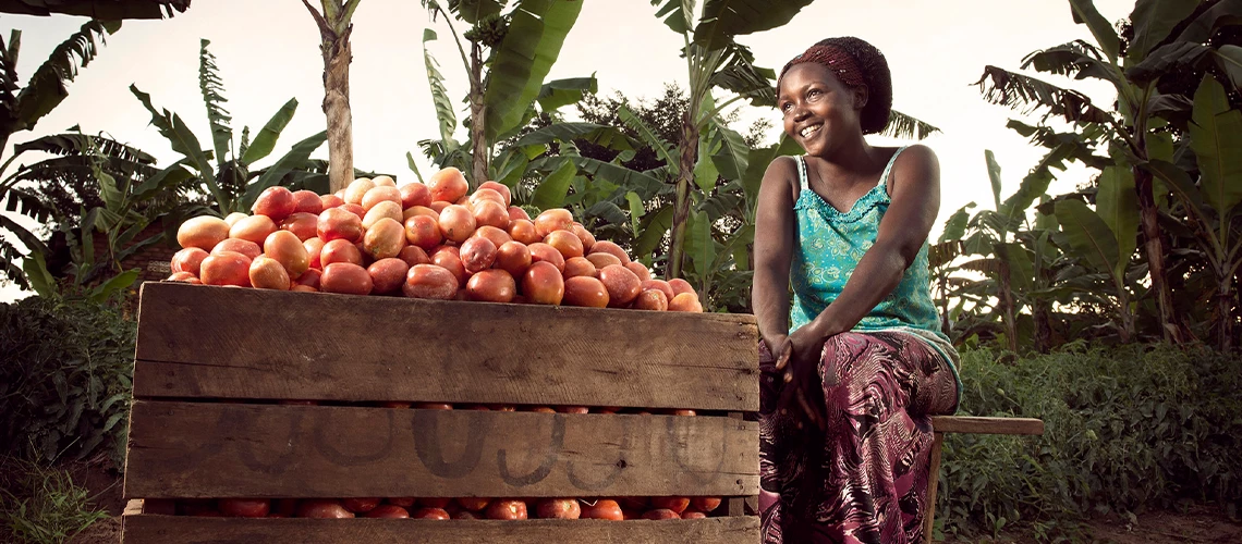 Olivia surveys the fruits of her labor in the waning afternoon sunlight on her farm near Kyotera, Uganda. 