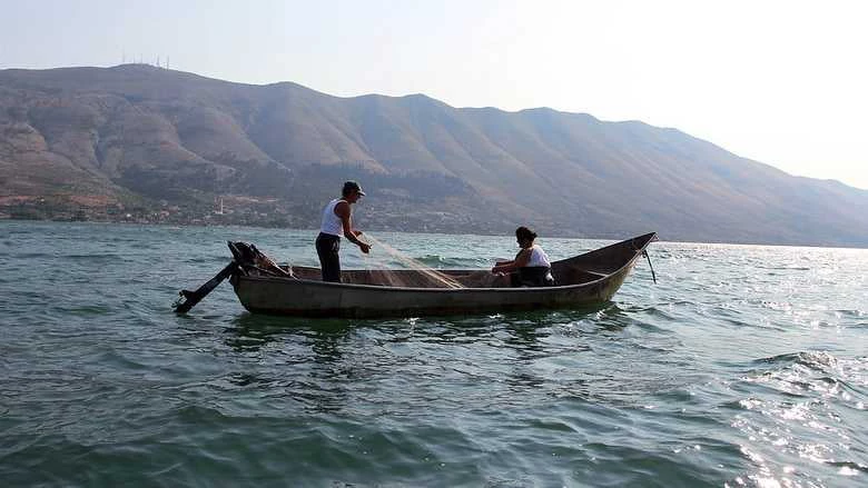 Fishermen preparing their fishing nets in Albania. Photo: Genti Shkullaku/World Bank