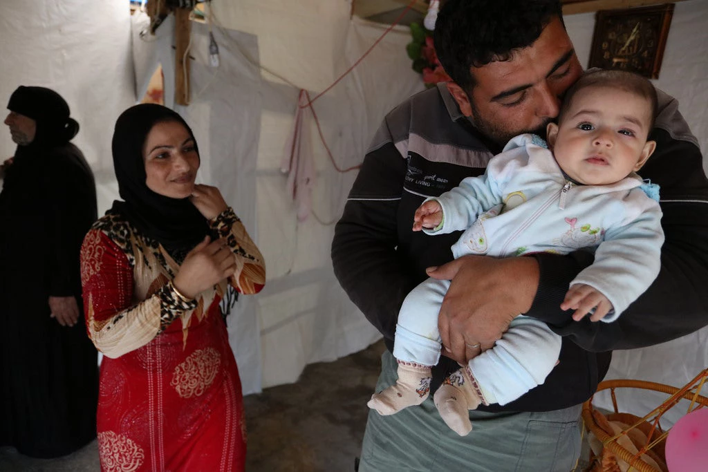 Denham and his family have been refugees living in this tent for the last four years. © Dominic Chavez/World Bank