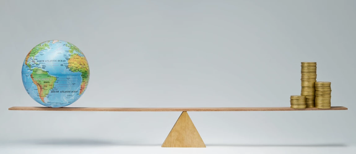 World globe and money coins stack balancing on a seesaw