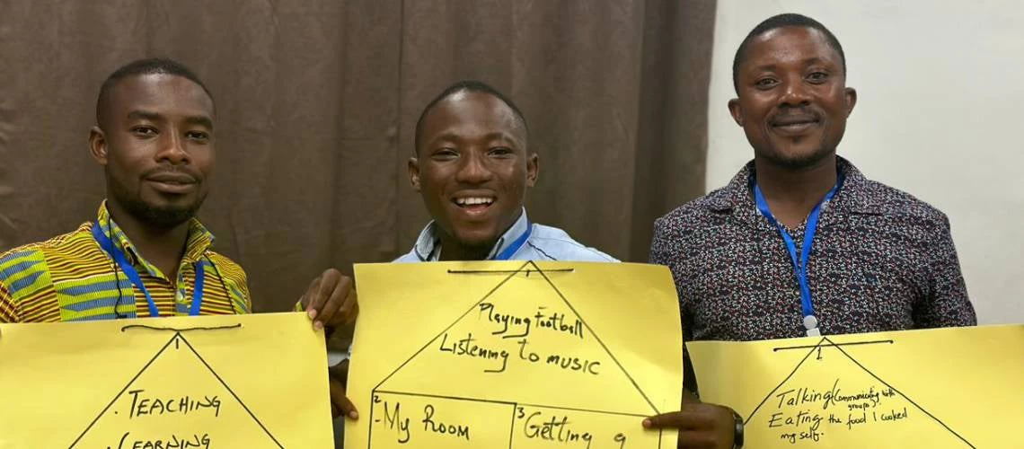 Staff of the national water utility in Ghana display materials from a leadership training session.