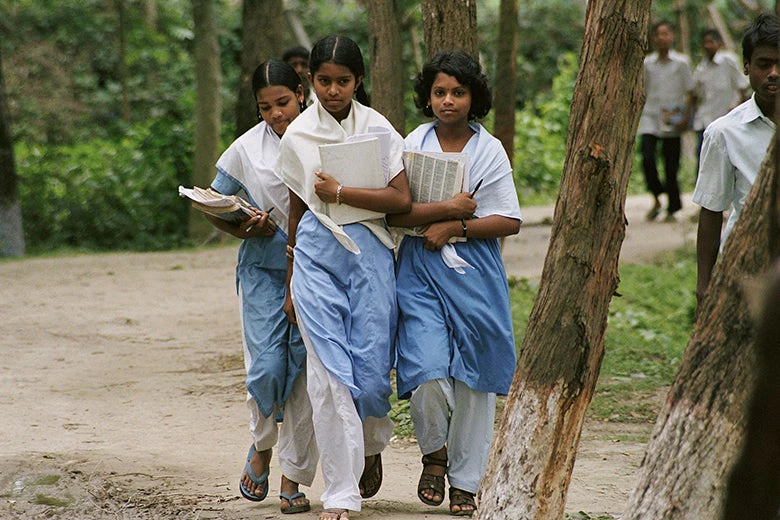 Three girls walk home from school in Bangladesh. Photo credit: Scott Wallace/World Bank