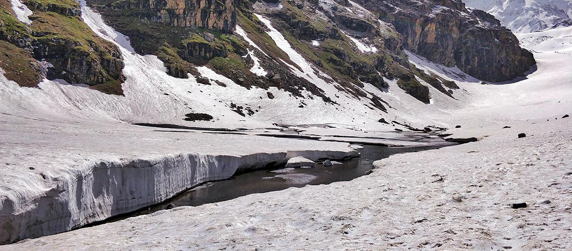 Mighty glacier in Indian Himalayan Mountains melting and breaking due to pollution and global warming.