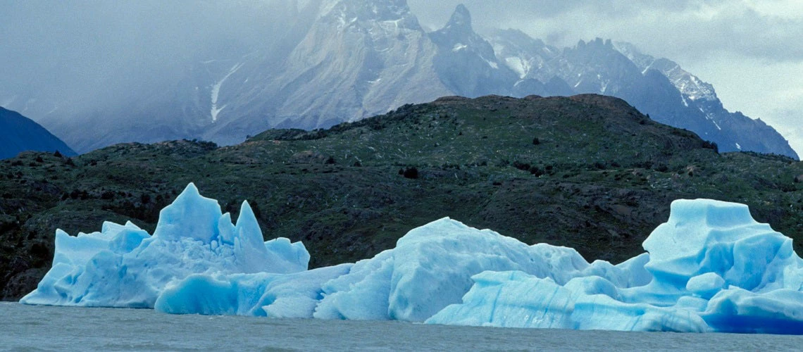 View of water, glaciers and mountains