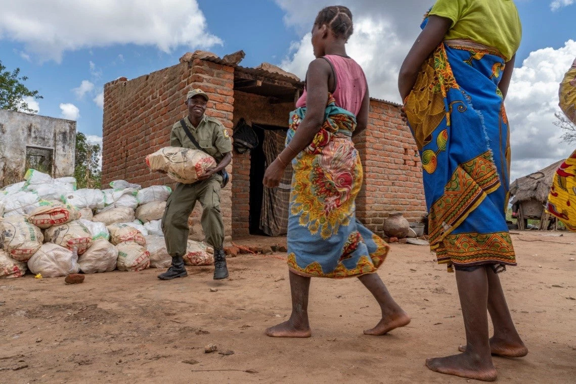 Gorongosa Park rangers distribute emergency food rations in the days after Cyclone Idai in March 2019. 