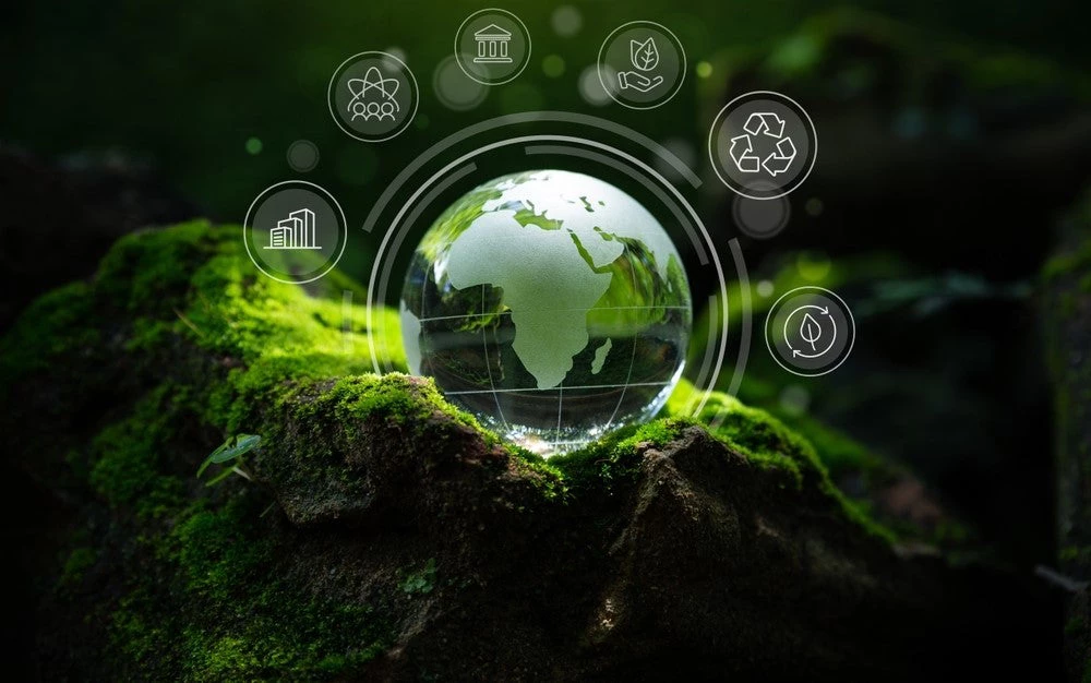 Crystal globe with green development icons. (Shutterstock.com/Thx4Stock)