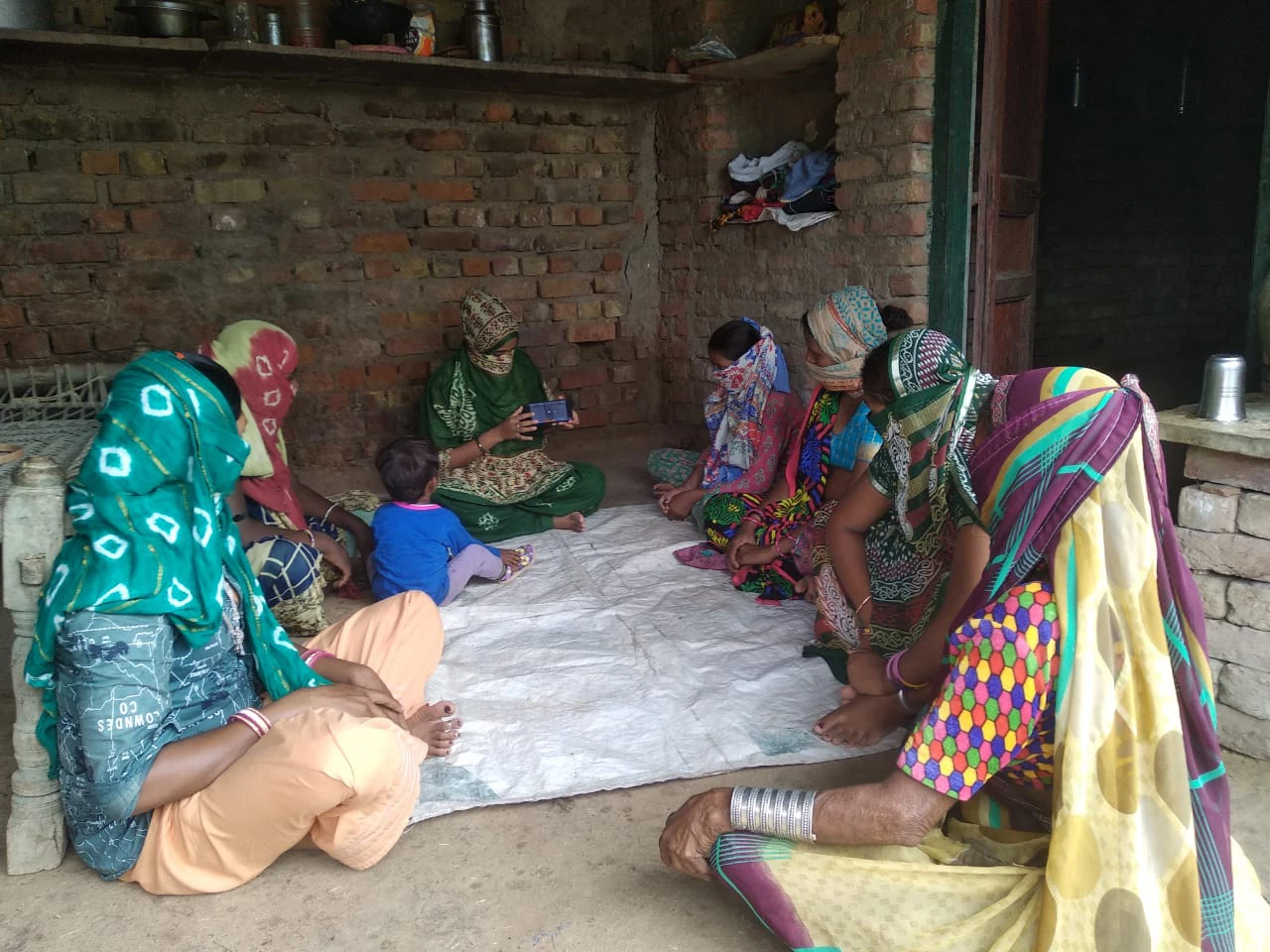 Self employed women learn how to carry out basic online transactions through their mobile phones enabling them to weather the pandemic?s disruptions.