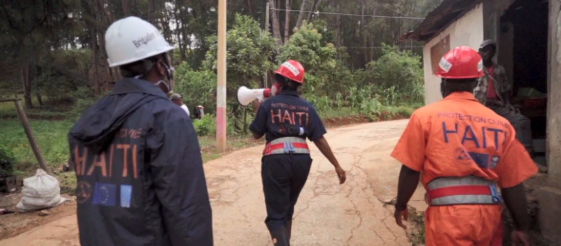 Construction workers on dirt road