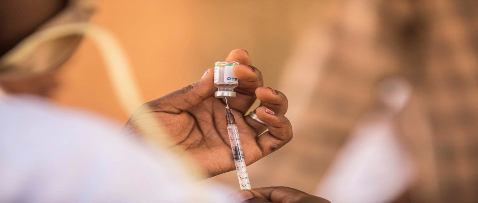Health worker administering an injection