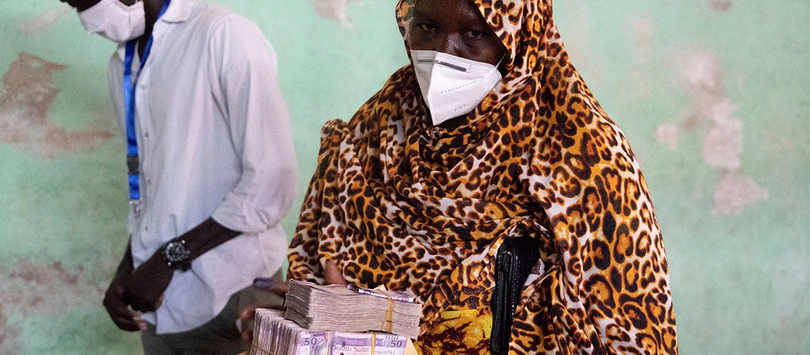 A beneficiary of the South Sudan Safety Net Project (SSSNP) after receiving her cash in Juba. Photo: Janet Maya Mulukwat, UNOPS (South Sudan)