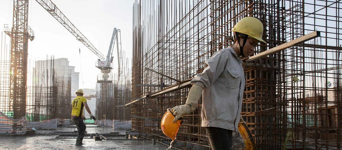 Construction workers at a construction site in Vietnam. 