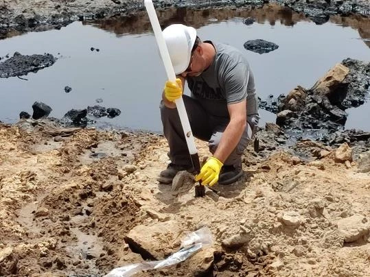 The team taking sample of soil contaminated by oil pollution.