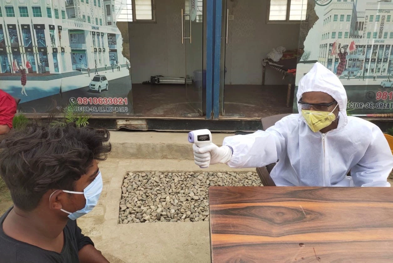 Worker being screened at the EDFC project site, India