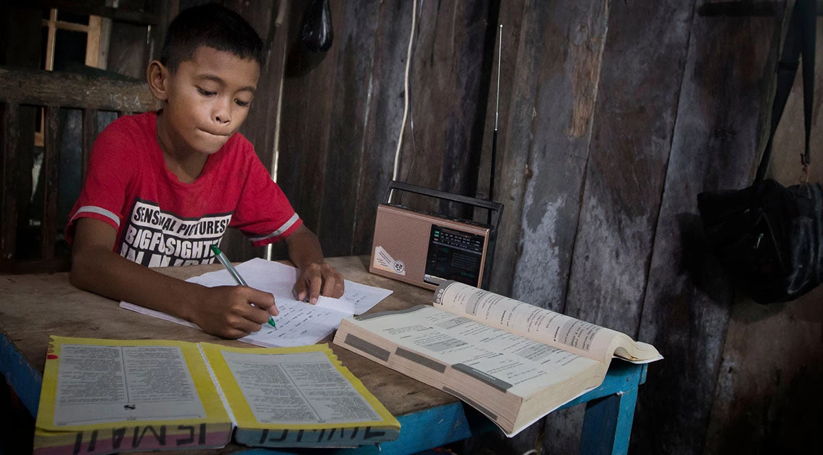 Sarmi, Papua-Indonesia, Portrait of Elementary school children learning in radio.