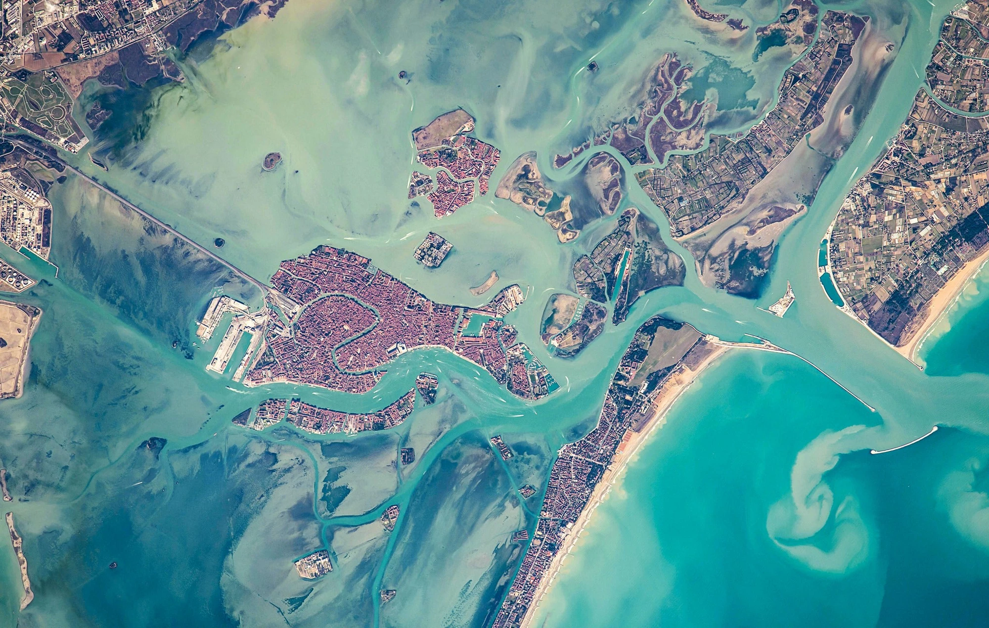 A satellite view of Venice and the surrounding lagoon. Upon completion of the MOSE project in 2018, a series of flood gates between the lagoon and the Adriatic Sea will protect the city from high tide and storm surges.