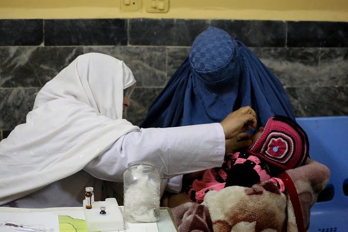 A local woman has brought her eight-month-old son to the Baidari Hospital in eastern Jalalabad city for vaccination.