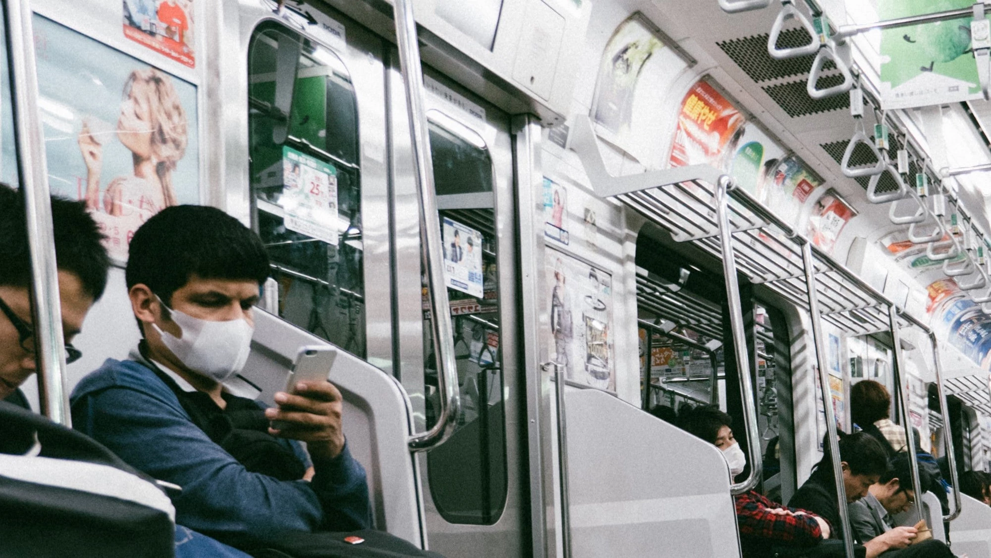 Commuters inside a metro train, Japan. Photo: Max Anderson/Unsplash